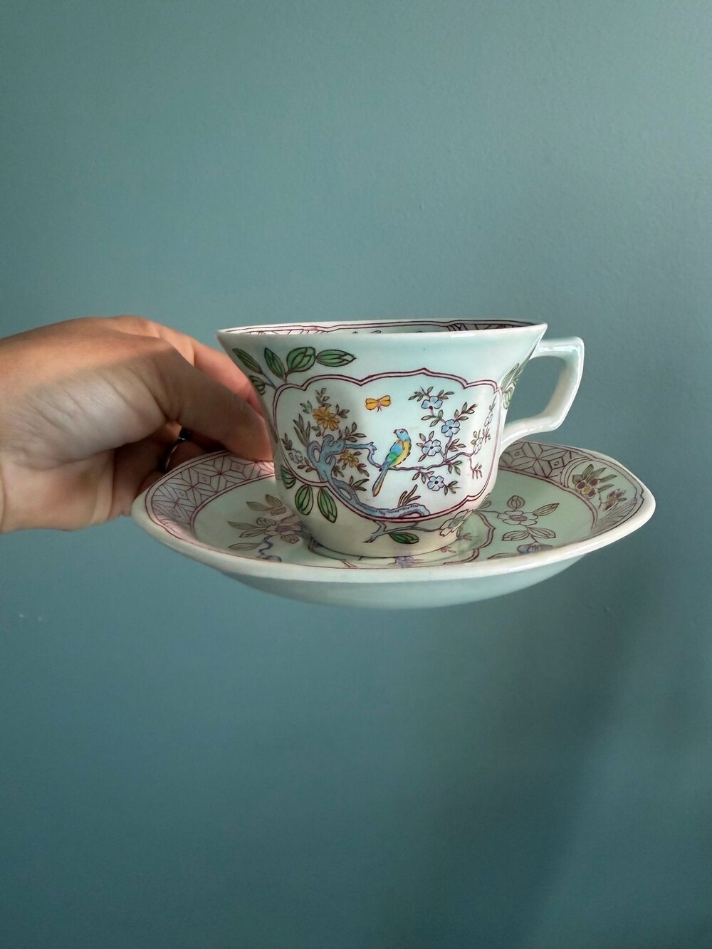 158 An Adams Calyx Ware Singapore Bird pattern teacup and saucer.